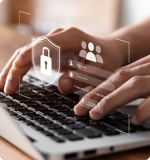 A person typing on a laptop, symbolizing secure website development with a padlock icon for enhanced online safety.